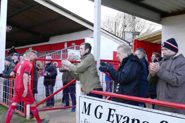 Fan-tastic: Supporters applaud their dejected heroes