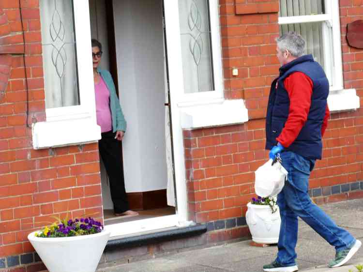 Neighbourly act: MP Craig Tracey delivering meals to the needy in Grendon on Monday