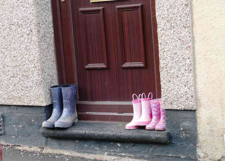 Doorstep challenge: Fitting the footwear on the front step