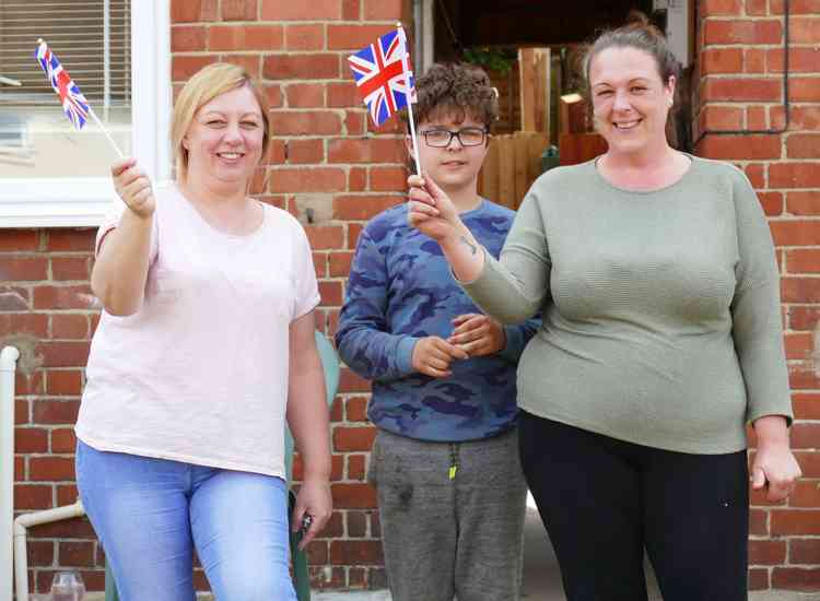 Flag wavers: Three more Westwood Crescent residents enjoying the day