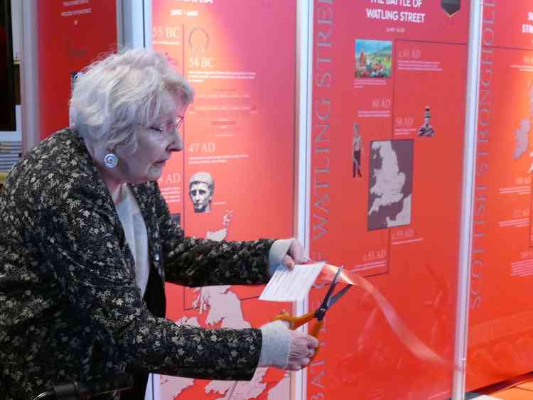 Opening ceremony: Margaret Hughes cuts the ribbon on the heritage centre launch in February