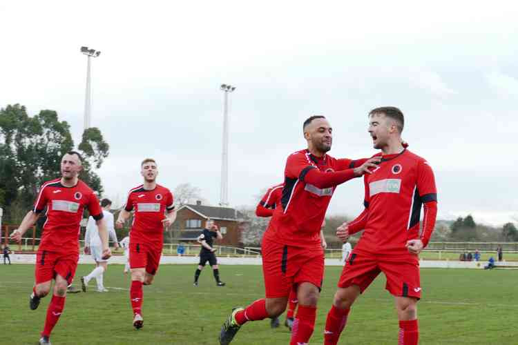 Good times (pre Covid-19): Joe Obi embraces Ryan Quinn after he gave Adders the lead against Consett in the FA Vase quarter final