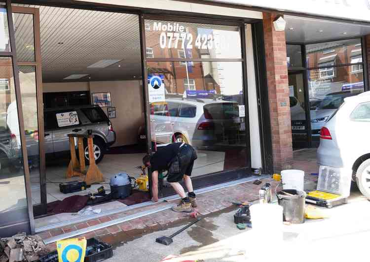 Running repairs: Work on the showroom ahead of reopening