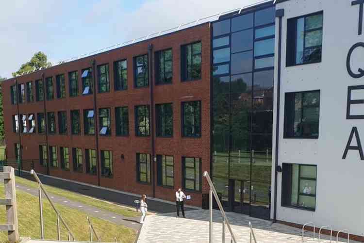 First in: A pupil greeted by the senior leadership team