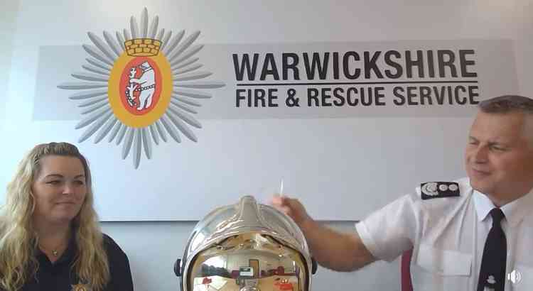 And the winner is: Chief Fire Officer Kieran Amos pulls another name out of the helmet as Gemma Childs looks on