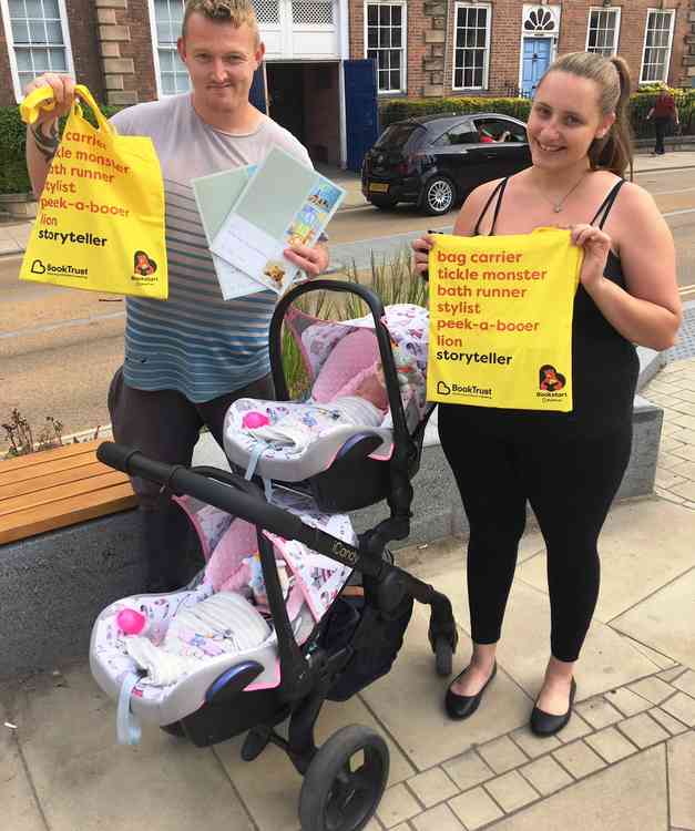 At the double: Proud parents Sophie-Mae Clews and Michael Bemrose with new packs for their twins girls Lillie-Rae and Violet-Mae