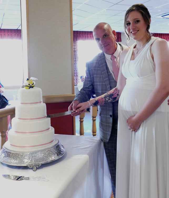 Tiers of joy: Cutting the cake