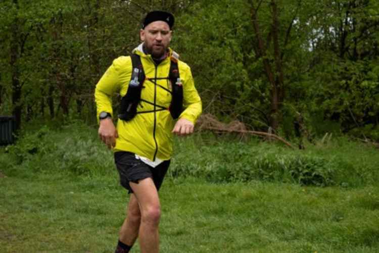 Mark Cox running during the race where he ran along the River Thames (Credit: Millie Jenkinson)