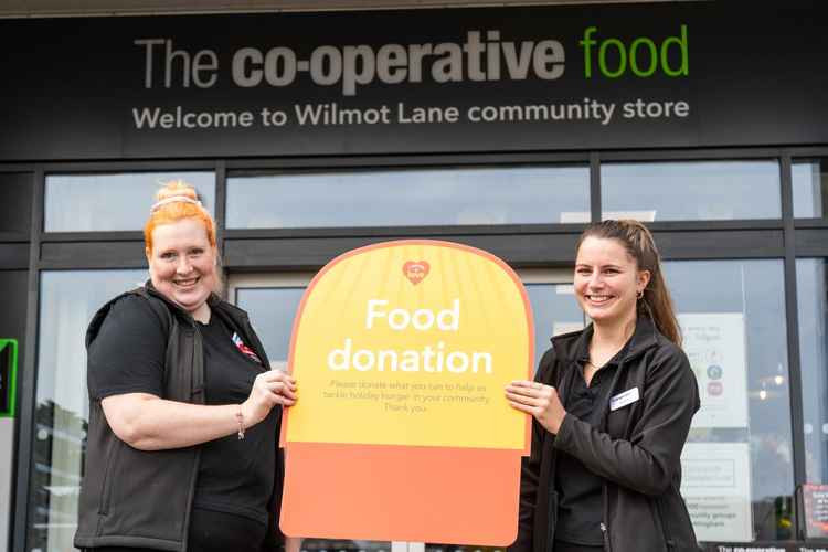 Central England Co-op colleagues mark the launch of the retailer's Summer Food Bank Appeal aiming to help tackle holiday hunger in its communities
