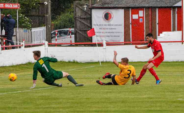 Tommo gun: Slide-rule precision by Mitch Thomson gives Atherstone Town the solitary goal win over Racing Club Warwick . . . Picture by Gary McGuffog