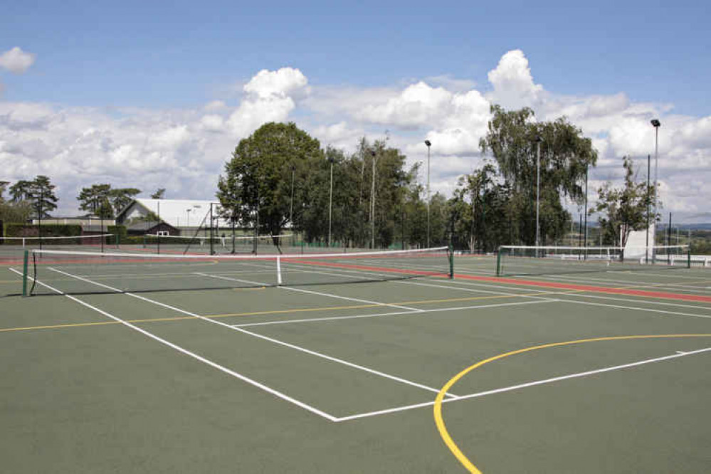 Two of the outdoor tennis courts at Millfield