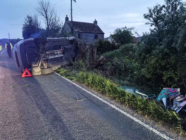 The car on its side in Compton Dundon (Photo: Somerton Fire Station)