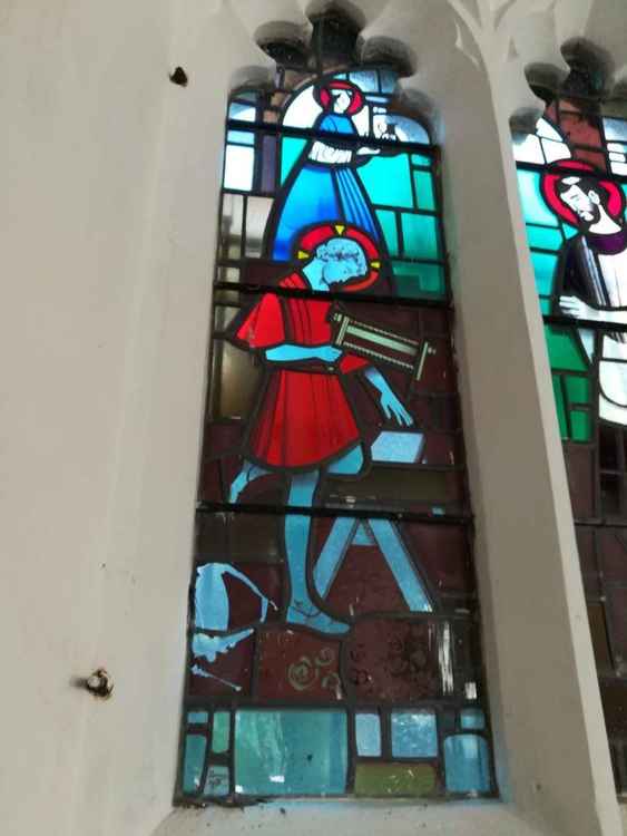 The damage to the Holy Family window, donated in memory of a past church warden