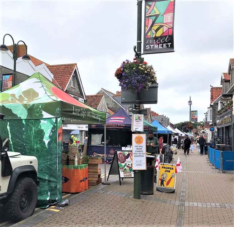 Stalls set up in High Street, Street, ready for a fun day of food, drink and entertainment