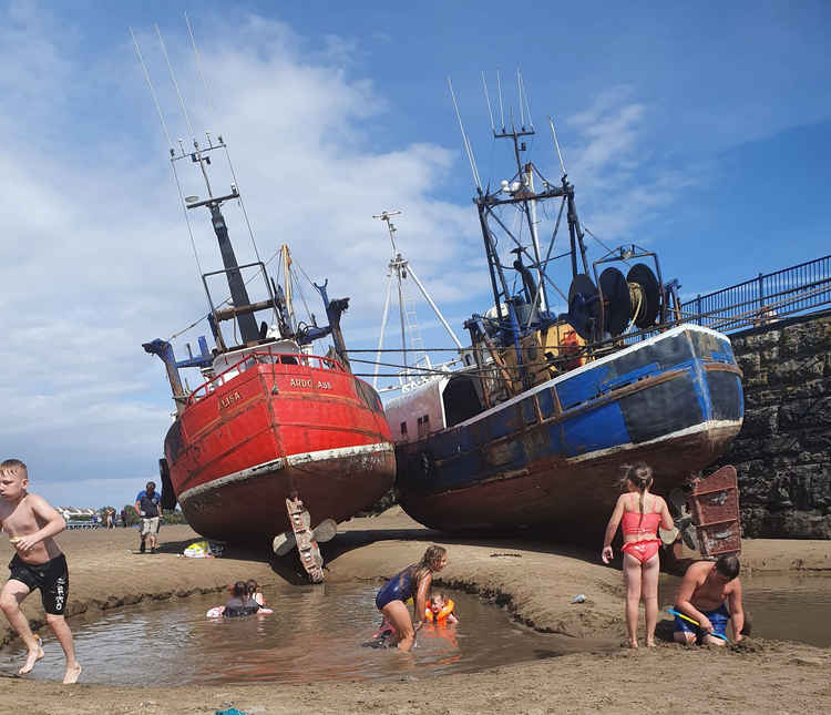 Barry residents enjoyed playing in pools created by the boat propellers and tide this summer