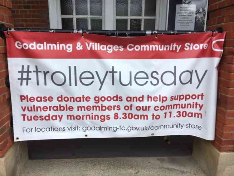 A banner at the Borough Hall calls for donations.