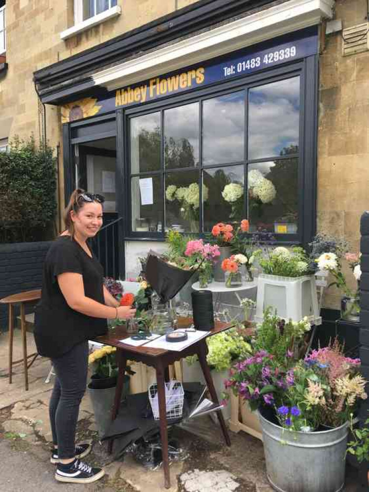 Florist Mollie Tidbury works on an arrangement.