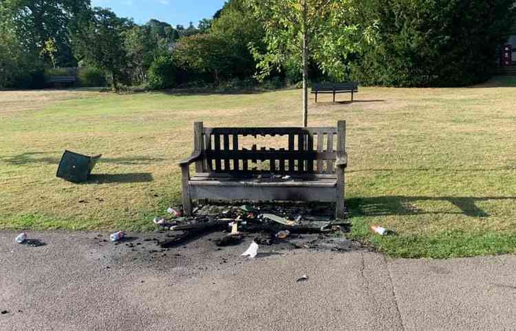 The fire-ravaged bench.