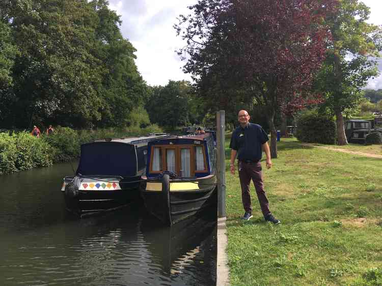 The Farncombe Boathouse also offers non-residential moorings: Russell is pictured on the island where the boats are moored.