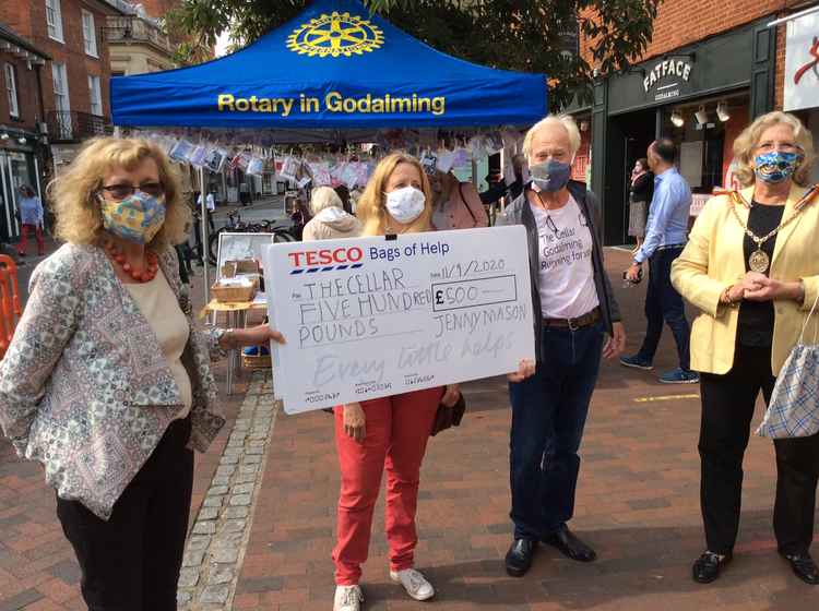 Jennifer Mason from Godalming Rotary, Emma and Dr Chris Jagger from The Cellar, and town mayor Penny Rivers are pictured with the cheque for £500 donated by Sewing4good.