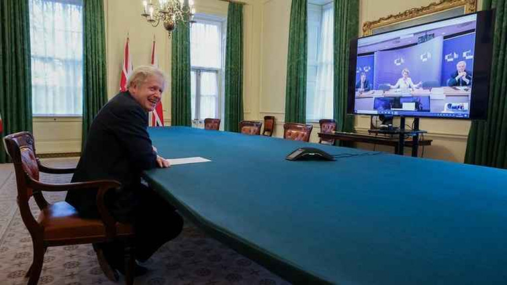 A relieved Boris Johnson in Downing Street today. On the screen is EU president Ursula von der Leyen.