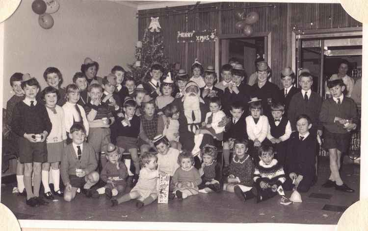 Children enjoy a Christmas party at Alan Paine's in 1967.