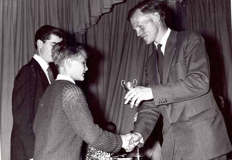 Wilfrid presenting a trophy to a young Mick Mills, who went on to captain the England football team at the 1982 World Cup. Photo courtesy of Godalming Museum.