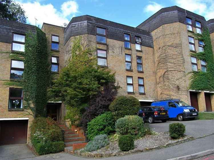 The apartment is in a popular development just below Charterhouse School.