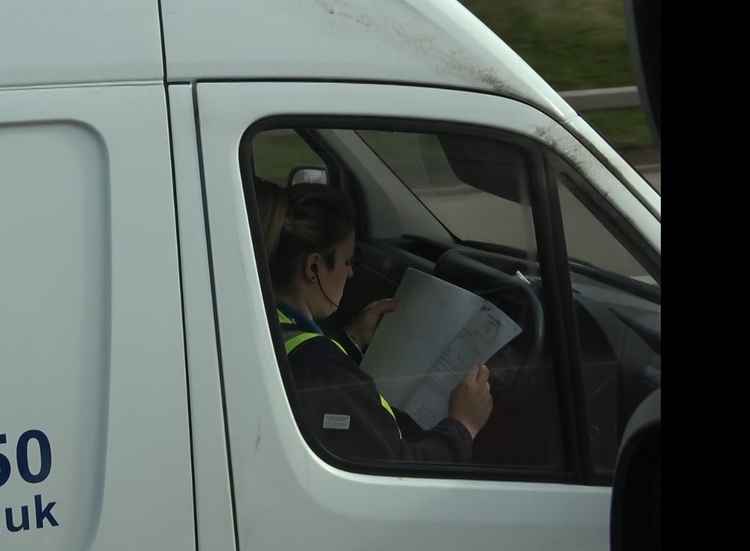 This driver looked to be catching up on some paperwork.