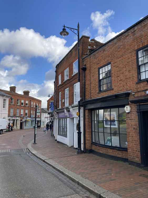 The streetlamp in the upper High Street, close to the spot of one of the original electric lamps, bears a plaque marking the refurbishment of all Surrey's streetlights in 2014.