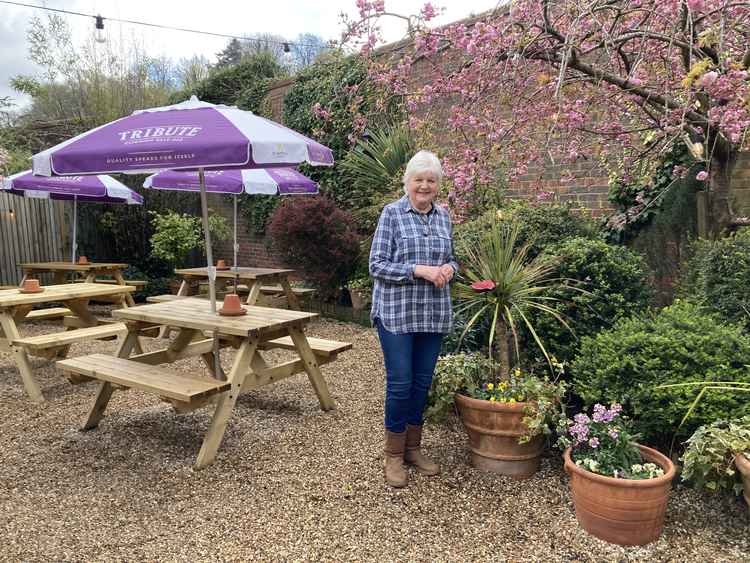Landlady Diane Crathern in the secret garden at The Richmond Arms.
