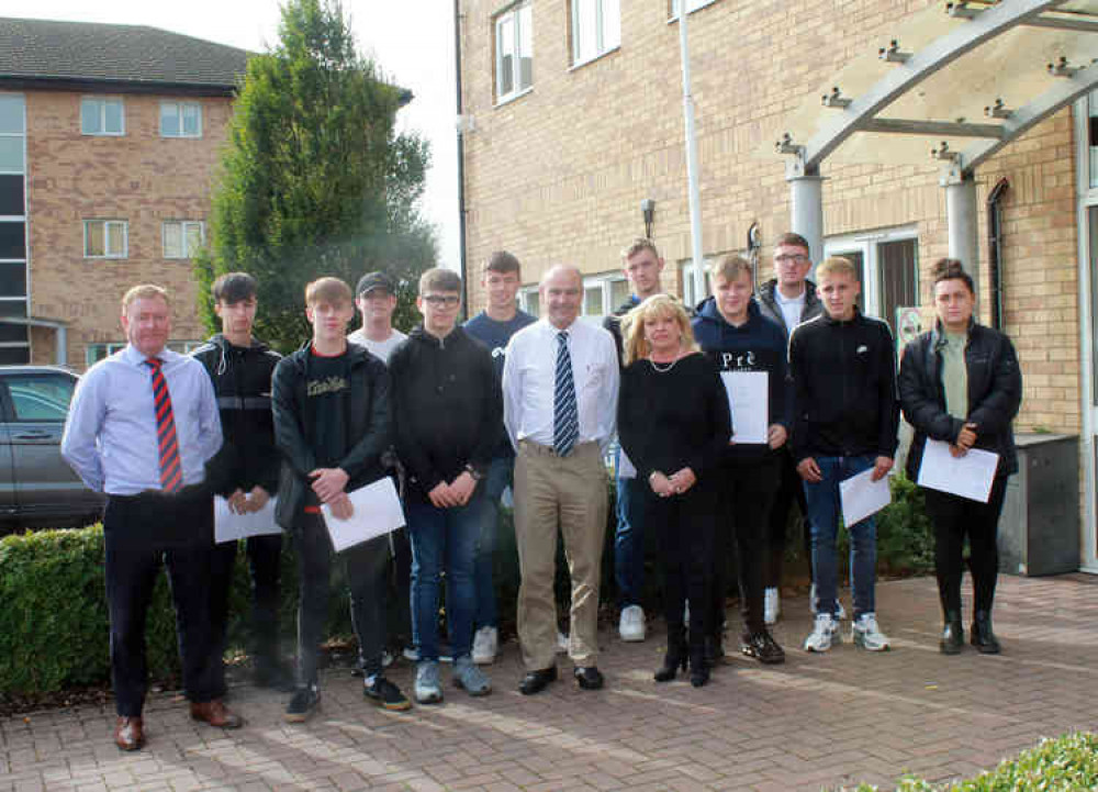 Some of the apprentices with, centre, Karl Hick, chief executive of Larkfleet Homes; Helen Hick, managing director and, left, Declan Cullen, construction director