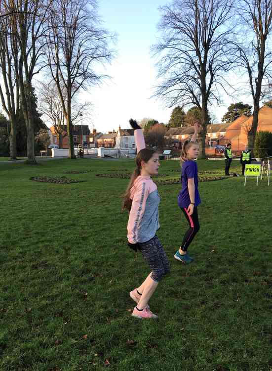 Olivia and Grace Marshall lead the Wyndham junior parkrun warm-up