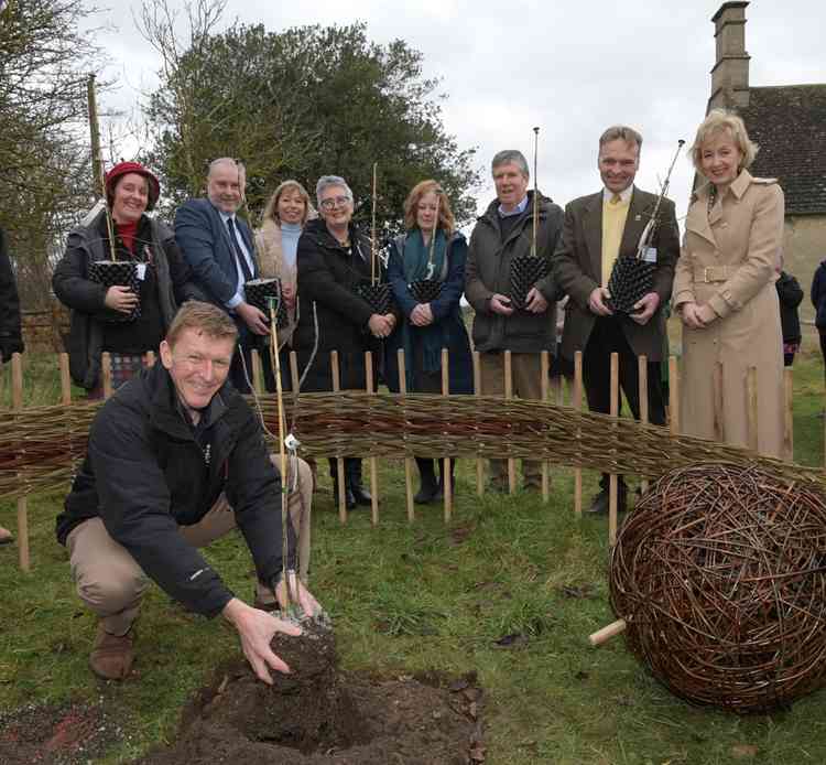 Tim Peake plants the sapling watched by (l-r) Kate Allies, Environmental Development Manager South Derbyshire District Council and Rouliston Forestry Centre, Martin Pearson, CEO Catalyst Science Discovery Centre, Dr Alice Bunn, International Director UK S