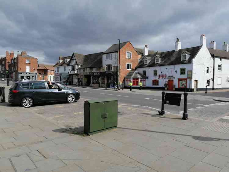 In the distance, police patrol a near empty Westgate