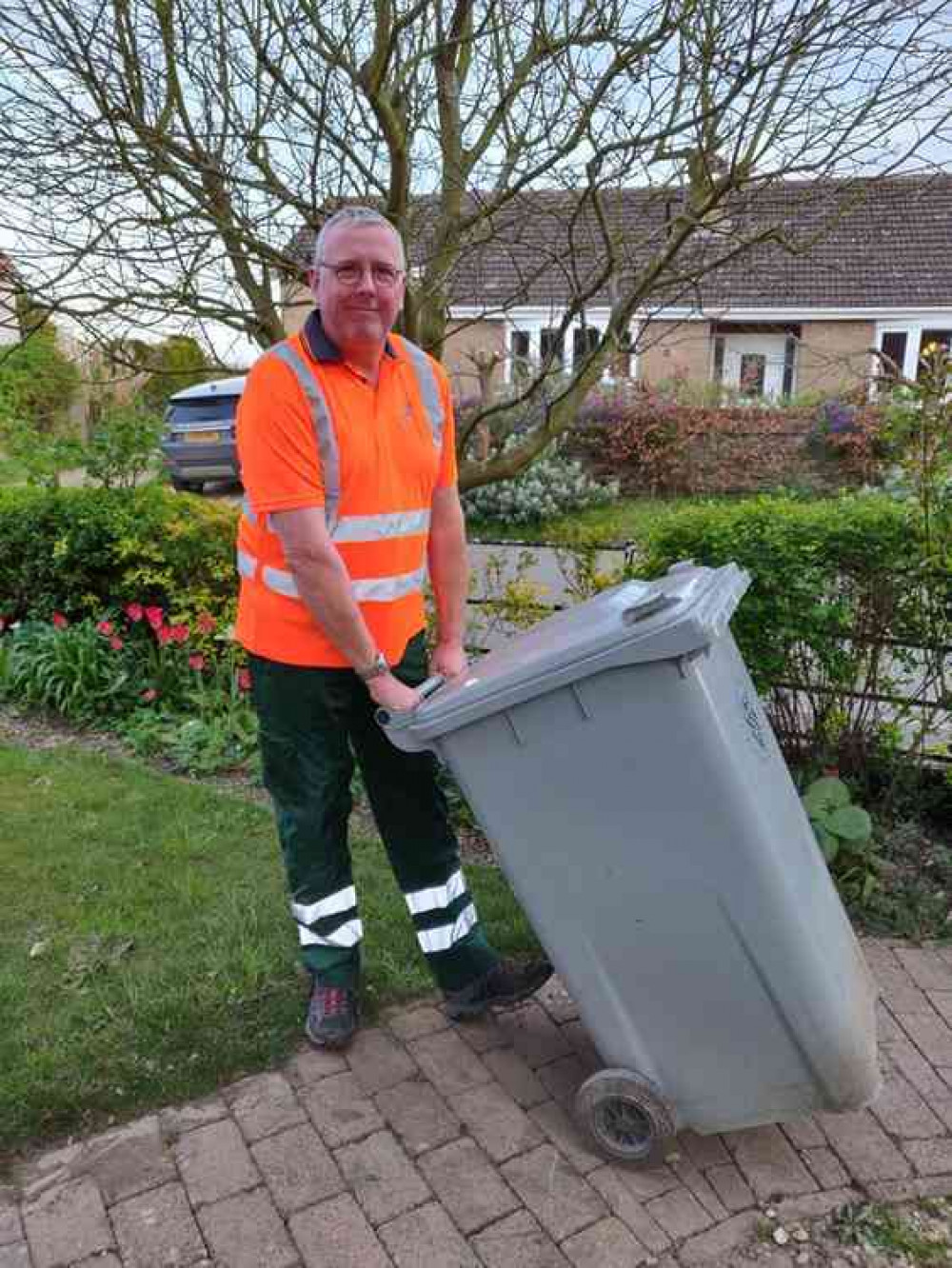 Coun Dr Peter Moseley when he recently went out with SKDC's binmen