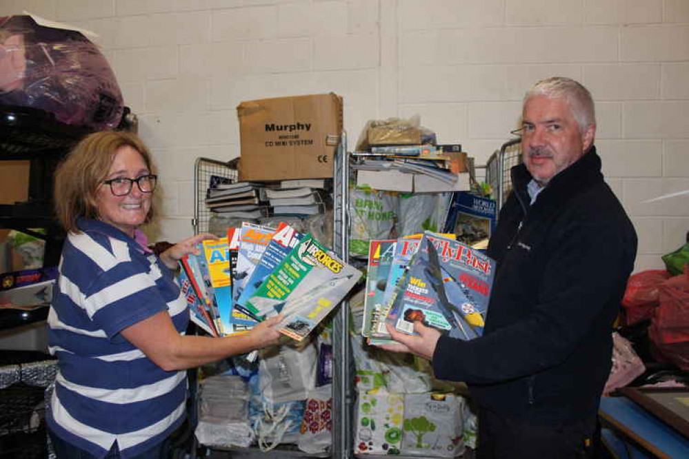 Stella Darker and John Redford from SKDC Tenancy Services with part of the magazine collection