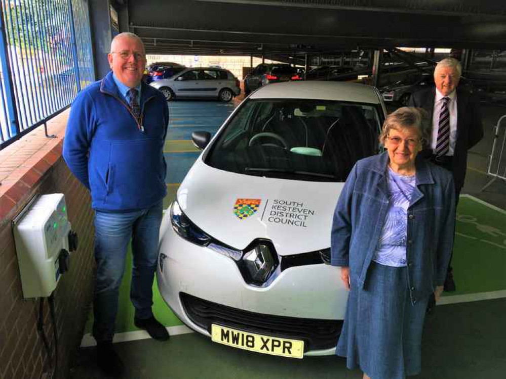 Cabinet Member for Commercial and Operations, Cllr Dr Peter Moseley at the charging points with Ward Members Cllrs Jacky Smith and Ray Wootten