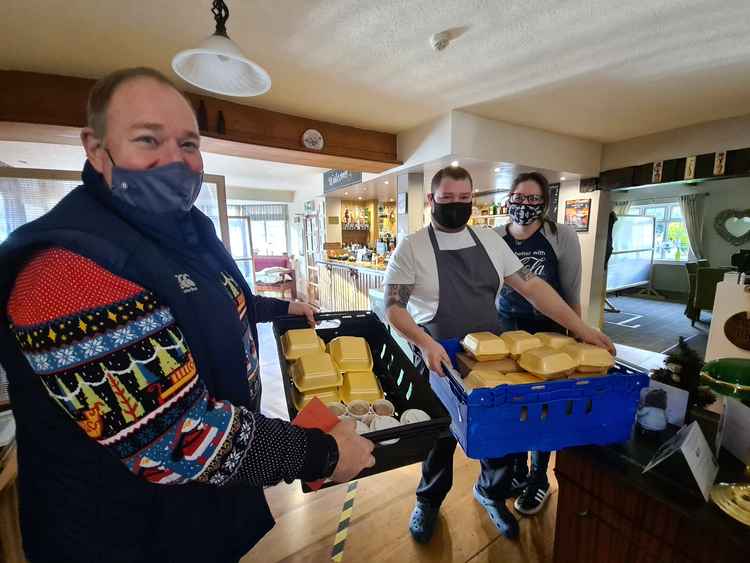 Welby parish councillor Michael Priestley (front), with Crown and Anchor chef and co-owner Peter Turner and Yasmine Baxter