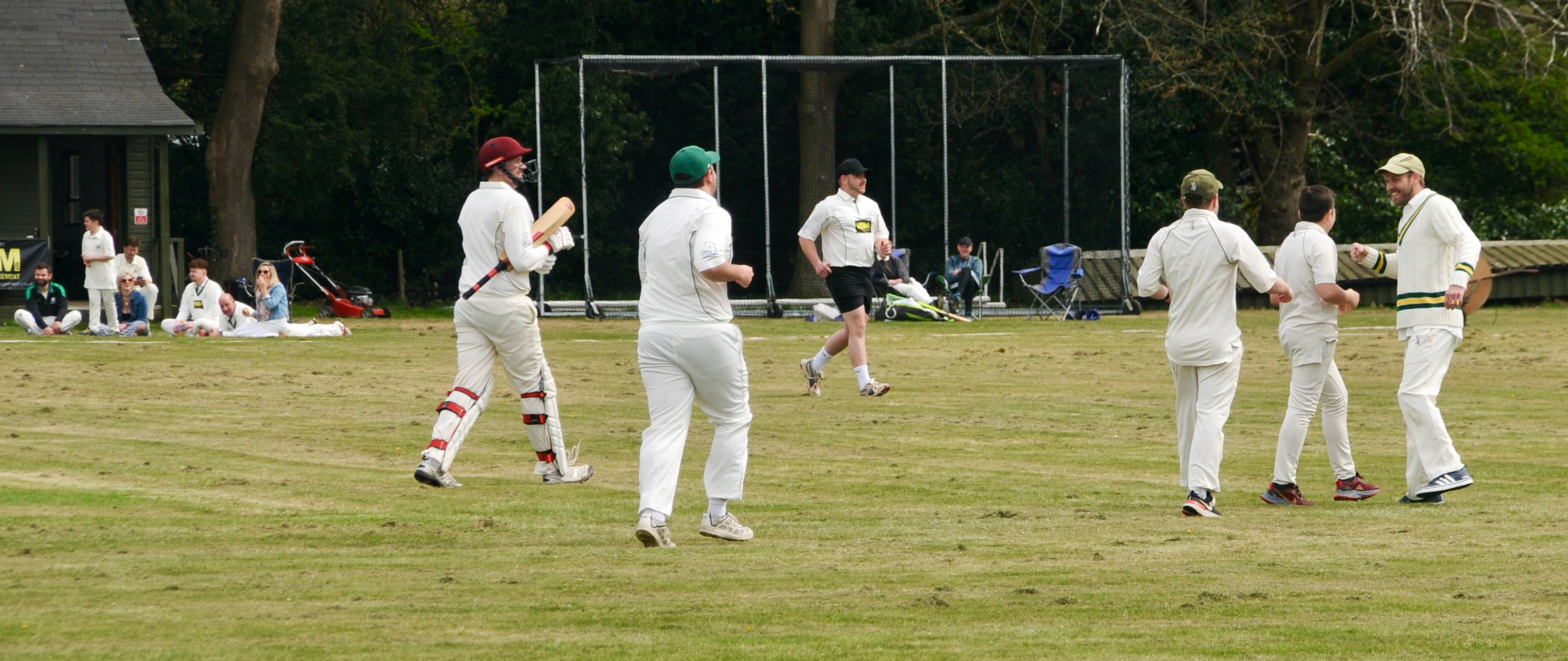 Father and son Ben and Josh Durrant celebrate after combining for a wicket (Picture credit: Peninsula Nub News)