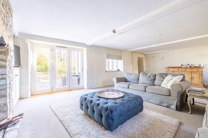 The large living room has French doors leading to a terrace