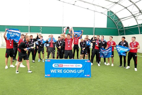 Crewe Alex players celebrate promotion to League One in 2020 as League Two runners-up (Kevin Warburton).