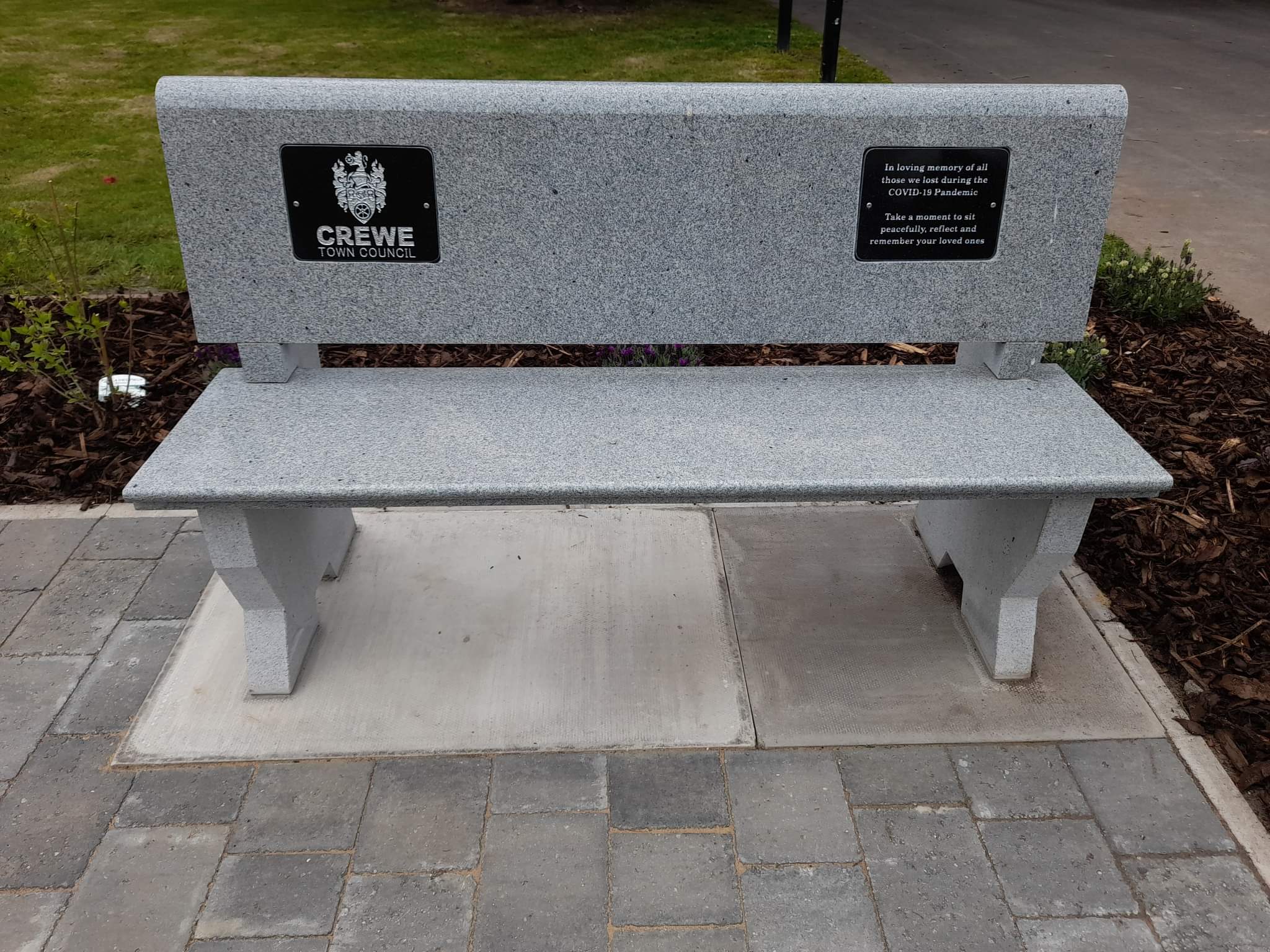 A close-up of one of the new memorial benches at Crewe Cemetery.