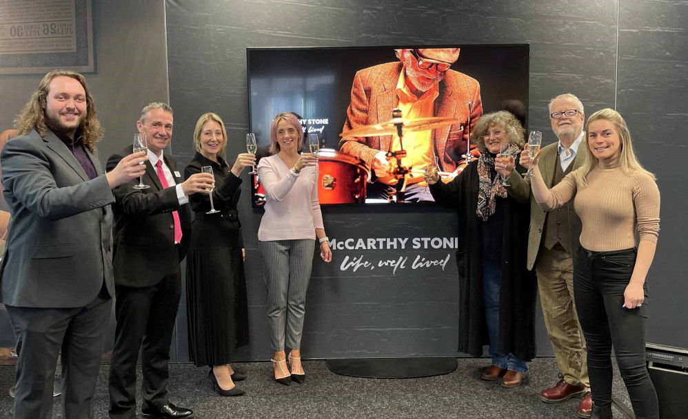 Declan Fishwick of McCarthy Stone (left) and Stephanie Cheadle of The Heart of Cheshire festival marketing firm and working group members raise a glass to a successful event.