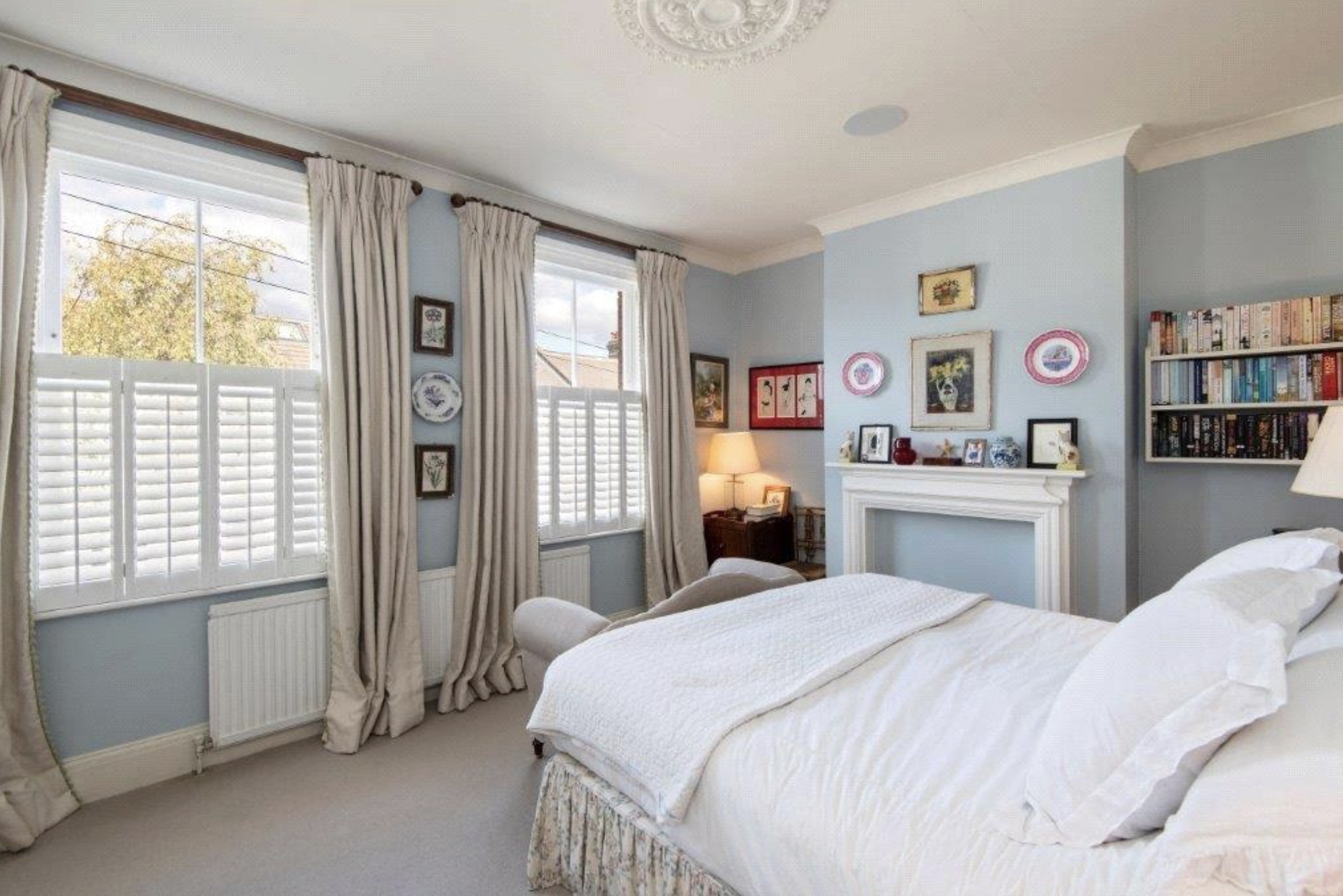 The principle bedroom with plantation shutters The third bedroom that would work well as a home office (credit: Chelwood Partners)