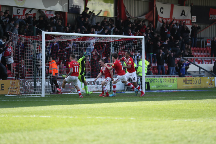 A joyous Tommy Lowery celebrates Crewe's late leveller (Picture credit: Kevin Warburton). 