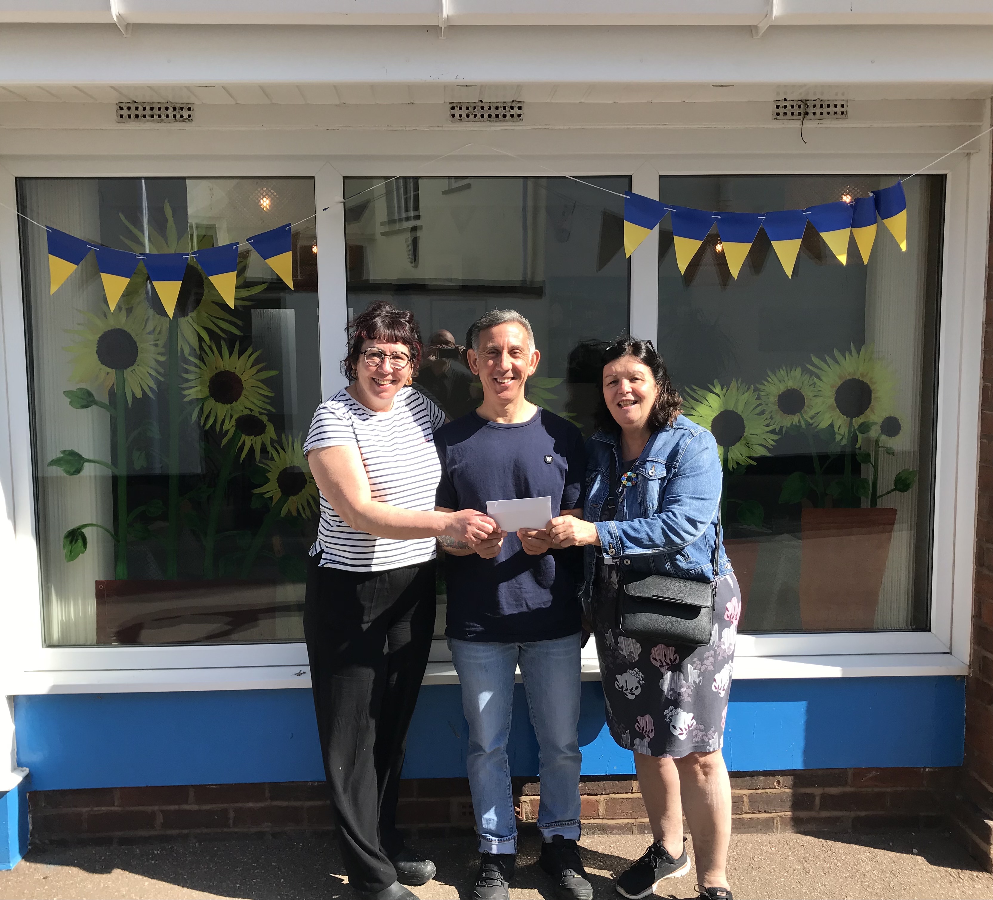 Sean Faulkner with June Ward and Sam Guck of Sidmouth Voluntary Services