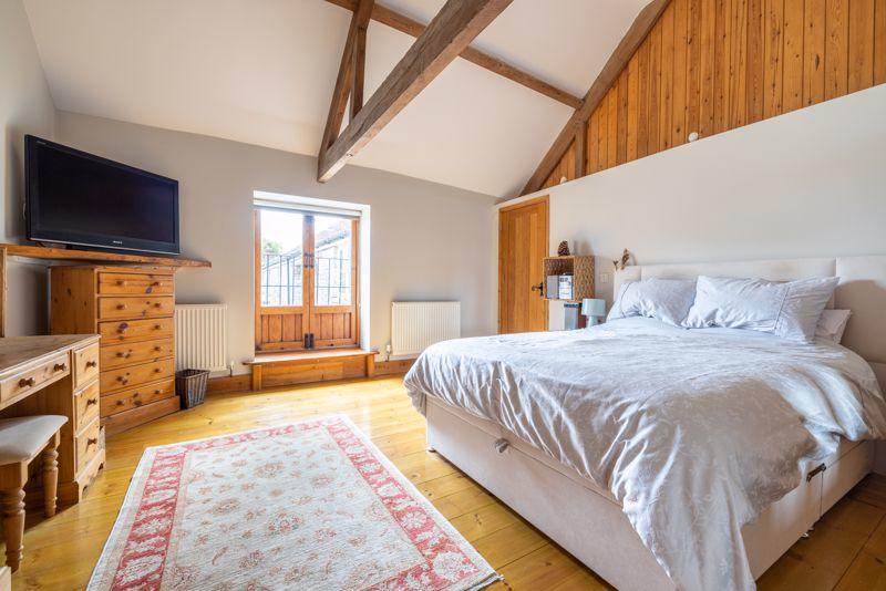 A bedroom with Juliet balcony