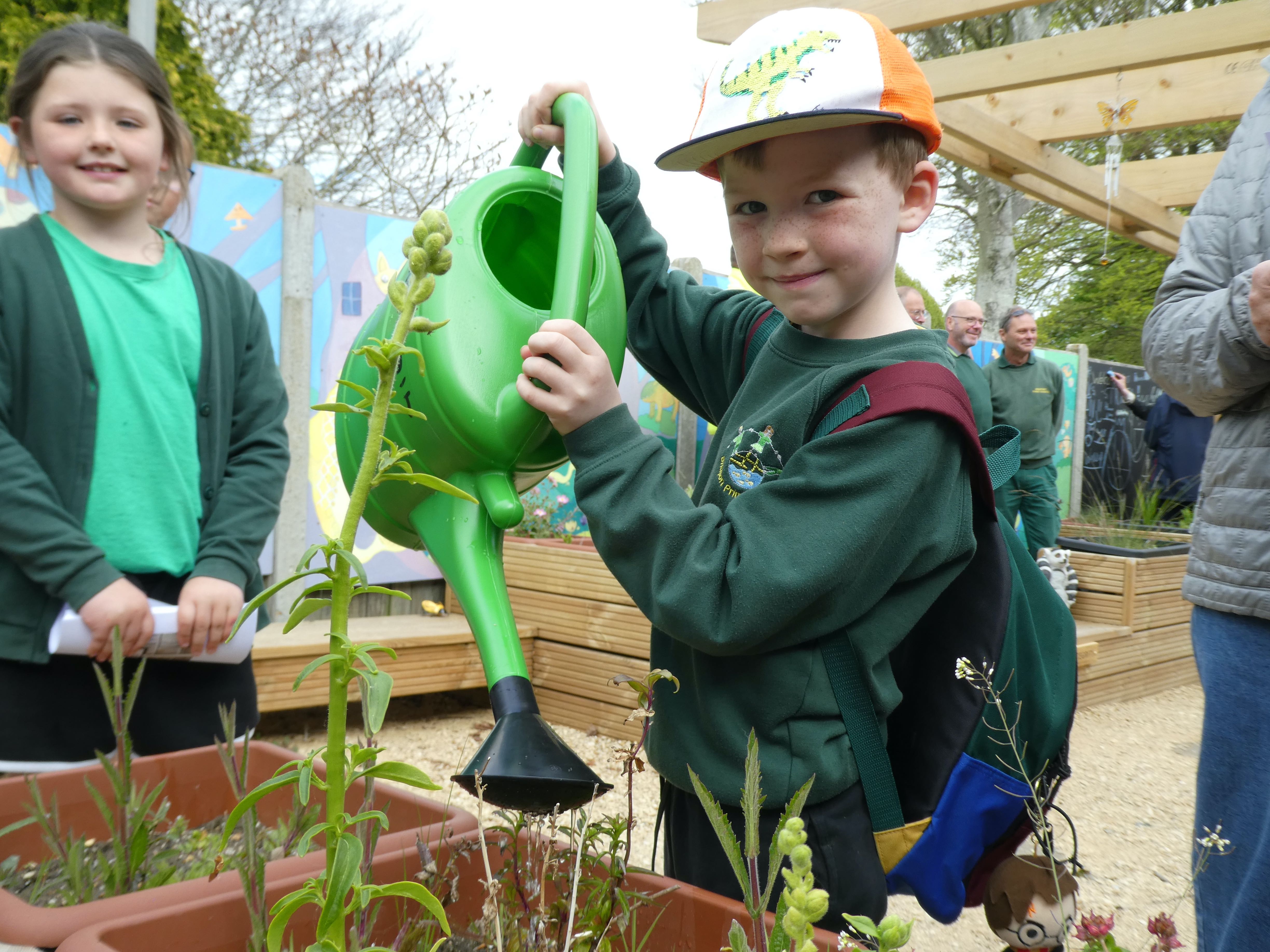 Oscar watering the plants