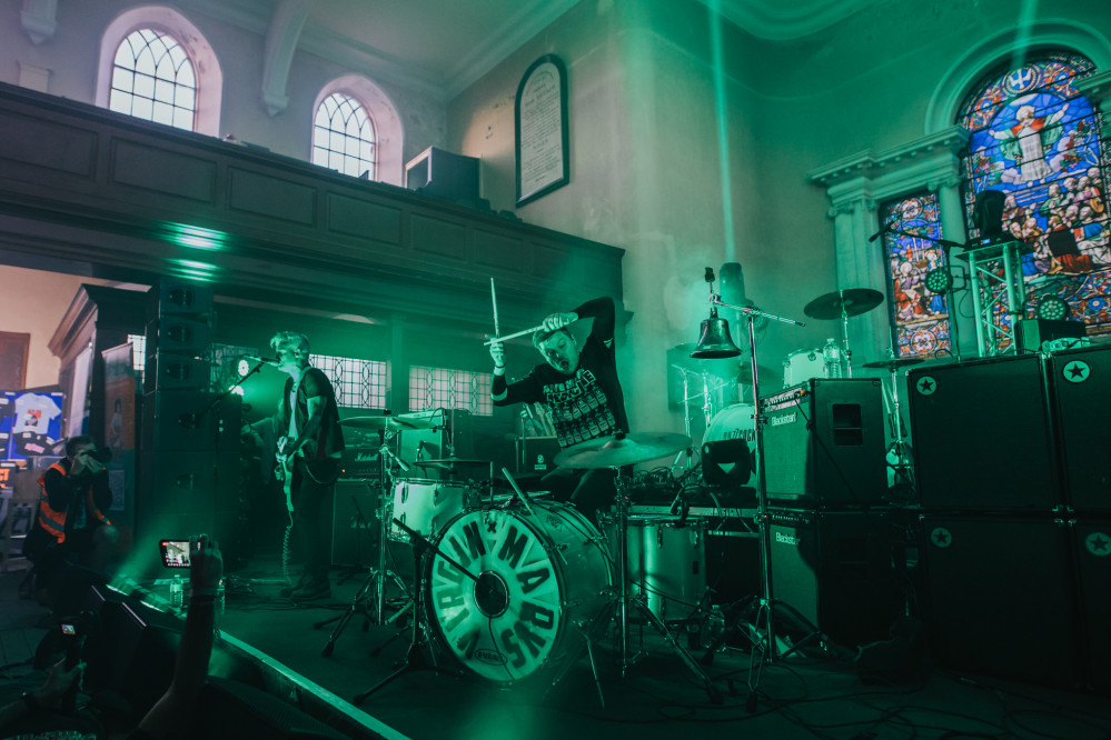 Ally Dickaty (left) and Danny Dolan of The Virginmarys (centre) looking mean in green. (Image - Victoria Greensmith Photography)